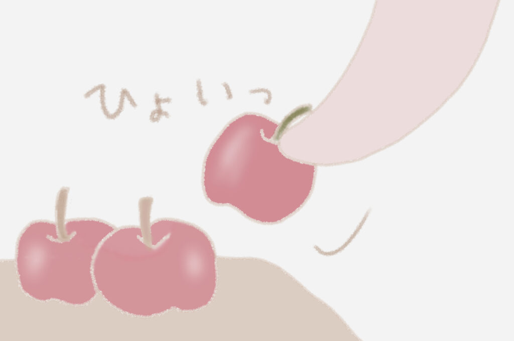うさこがりんごをひょいっと取る。